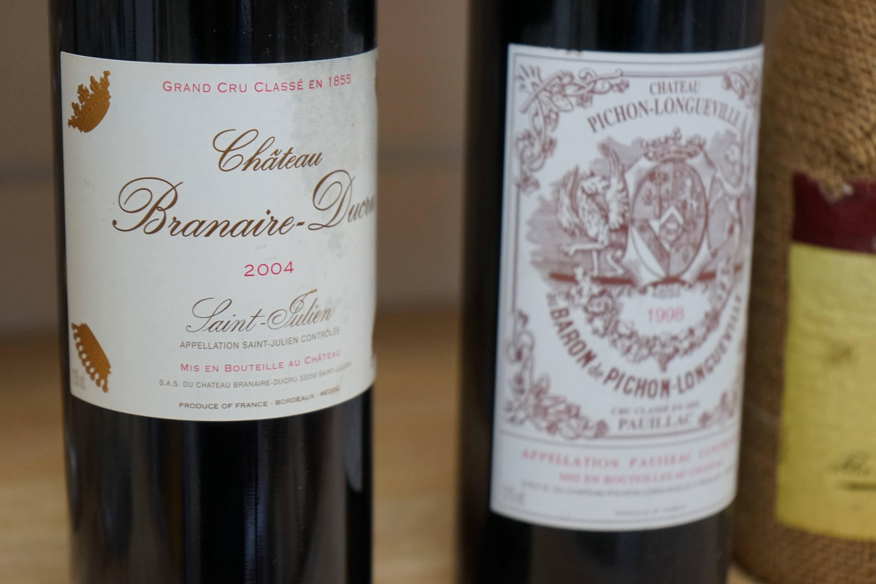 Four bottles of mixed wine to include Chateau Pichon Longueville 1998 and Chateau Branaire-Ducru 2004. Condition - fair, storage history unknown